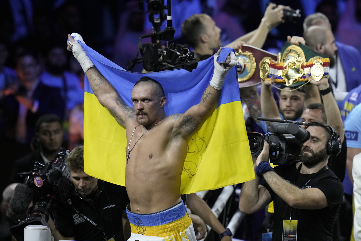 Ukraine's Oleksandr Usyk celebrates after beating Britain's Anthony Joshua to retain his world heavyweight title at King Abdullah Sports City in Jeddah, Saudi Arabia, Sunday, Aug. 21, 2022.